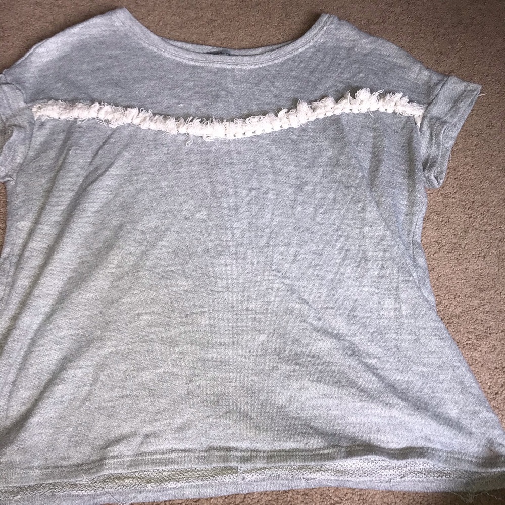 grey sweater tee with white stripe of white fringe